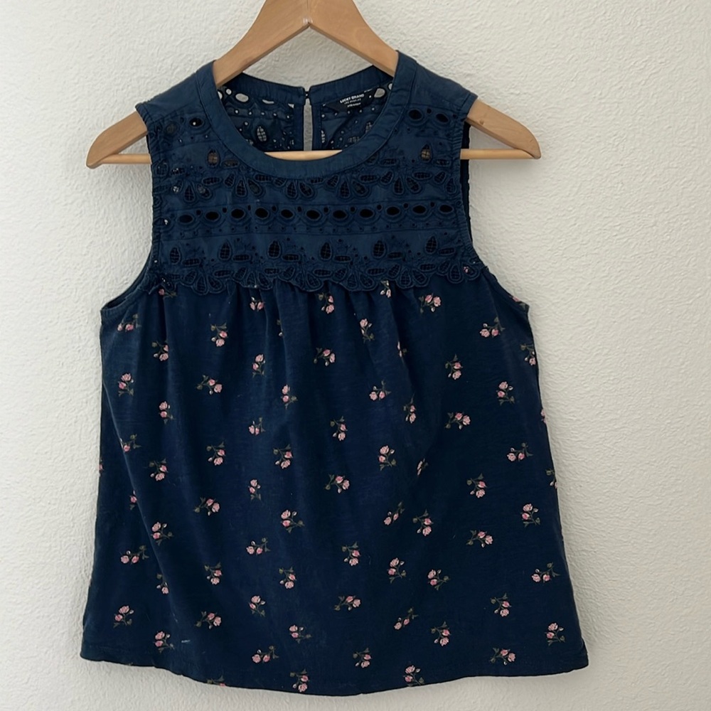 Lucky Brand sleeveless, high neck top with eyelet detail and button neck.